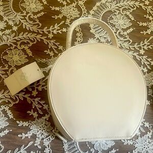 round cream tone bag